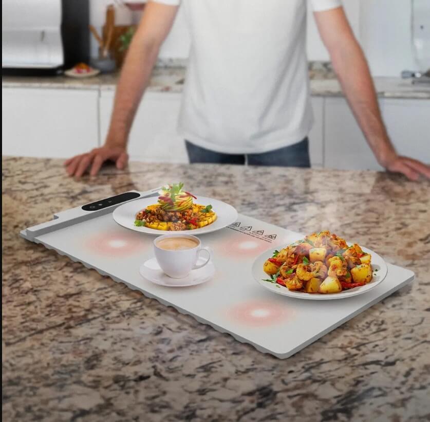 10989-products-680dce3d1a2dc.jpeg حافظ على وجباتك دافئة بأناقة – سجادة تسخين الطعام من Porodo Lifestyle سجادة طعام دافئة من بورودو لايف ستايل - بيضاء - الصورة 1